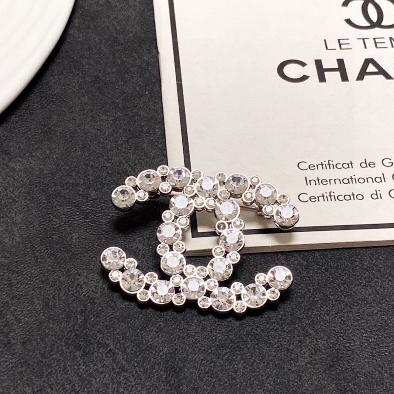 Ch**el brooches